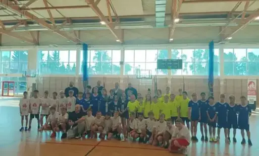 Zawodnicy z Marcinem Gortatem